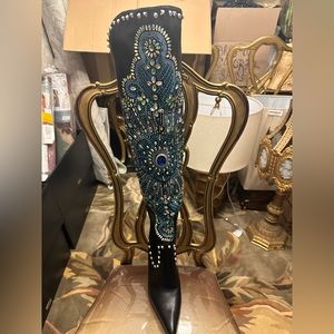 Shut it down pair of boots.  Thigh high rhinestone & studs. New, size 10.